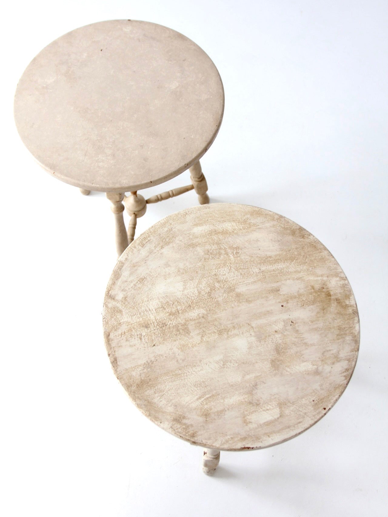 pair of vintage cottage pedestal tables
