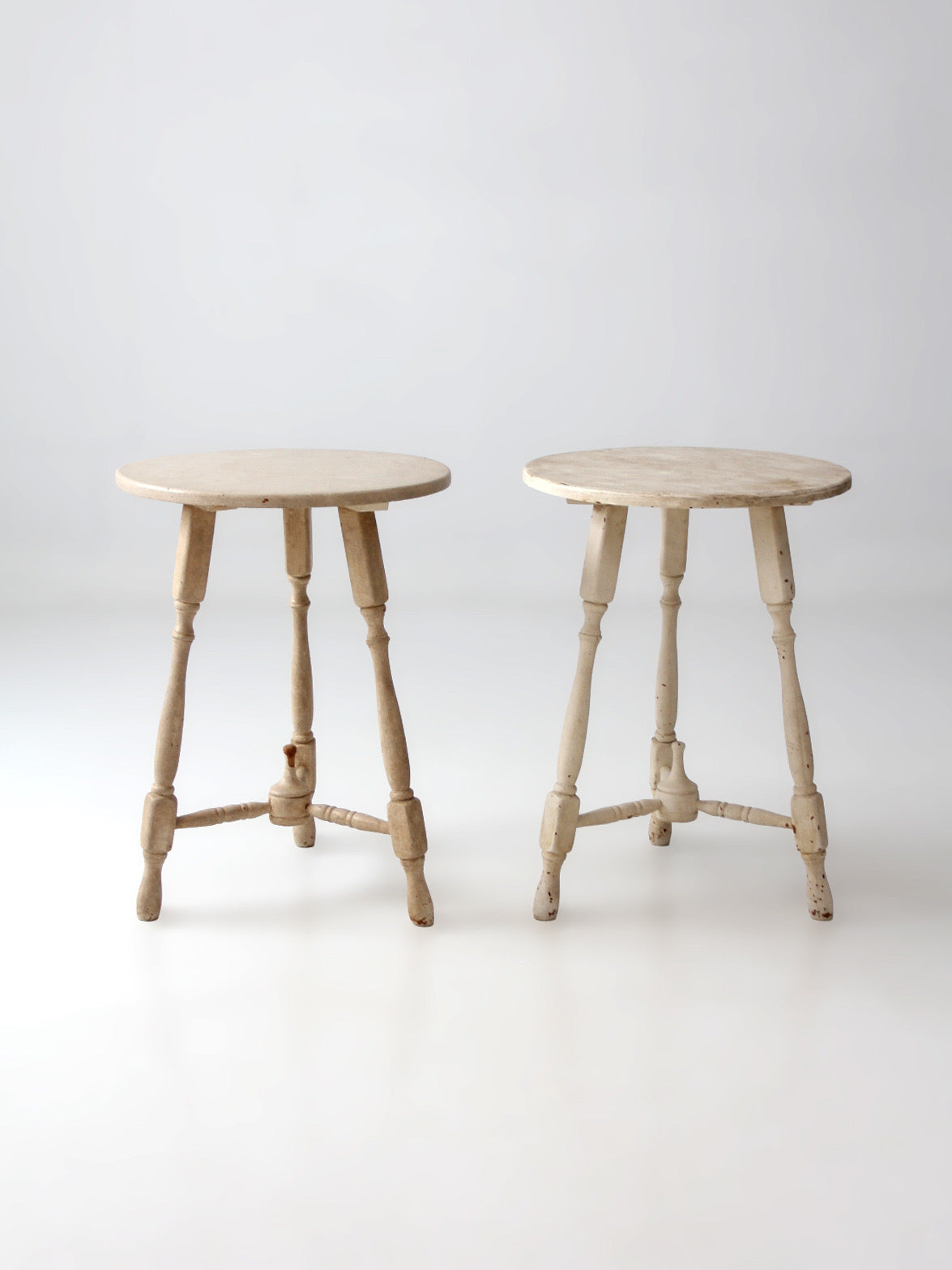pair of vintage cottage pedestal tables