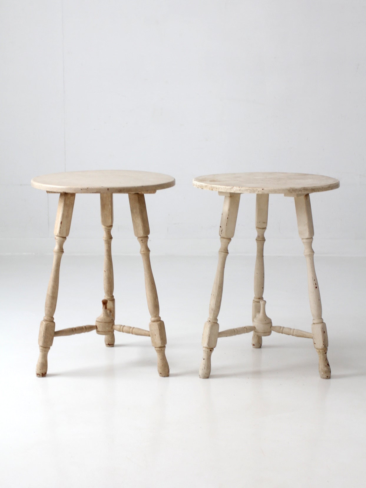 pair of vintage cottage pedestal tables