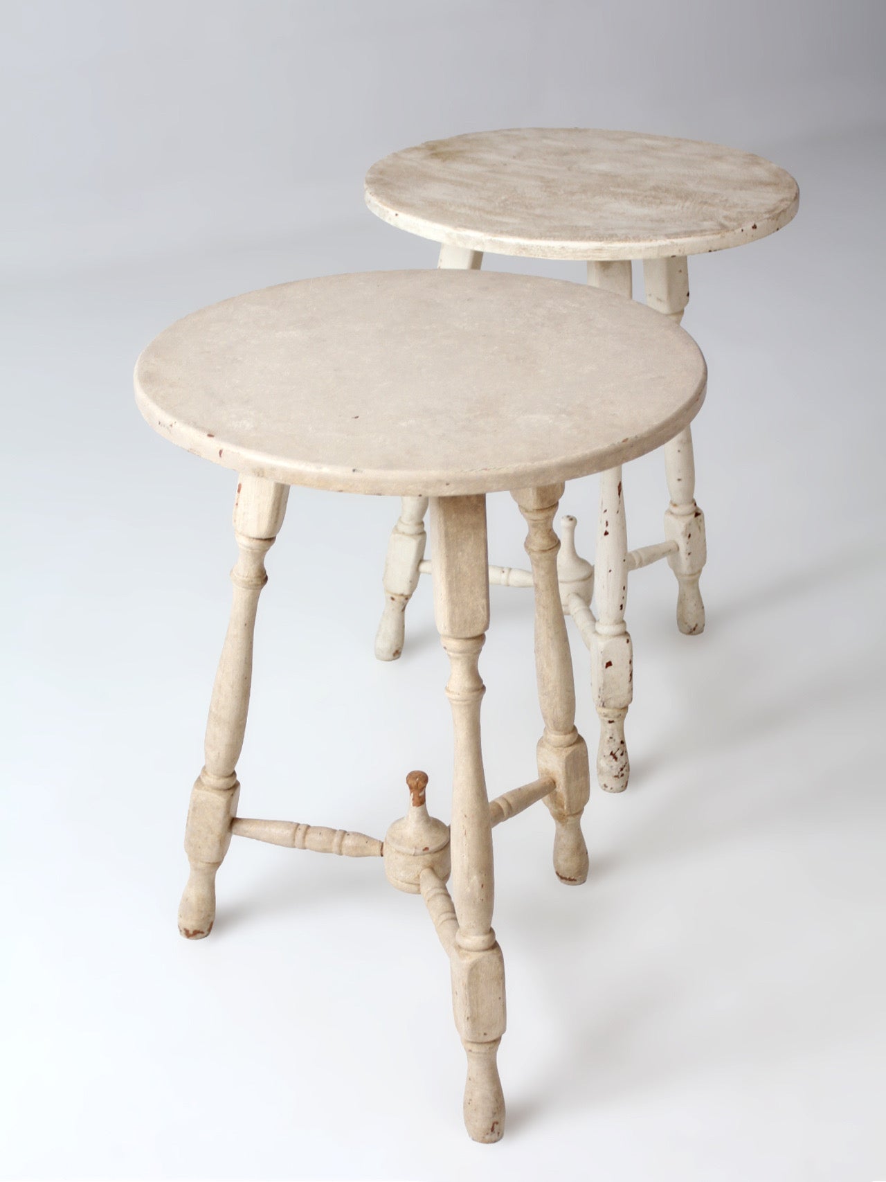 pair of vintage cottage pedestal tables