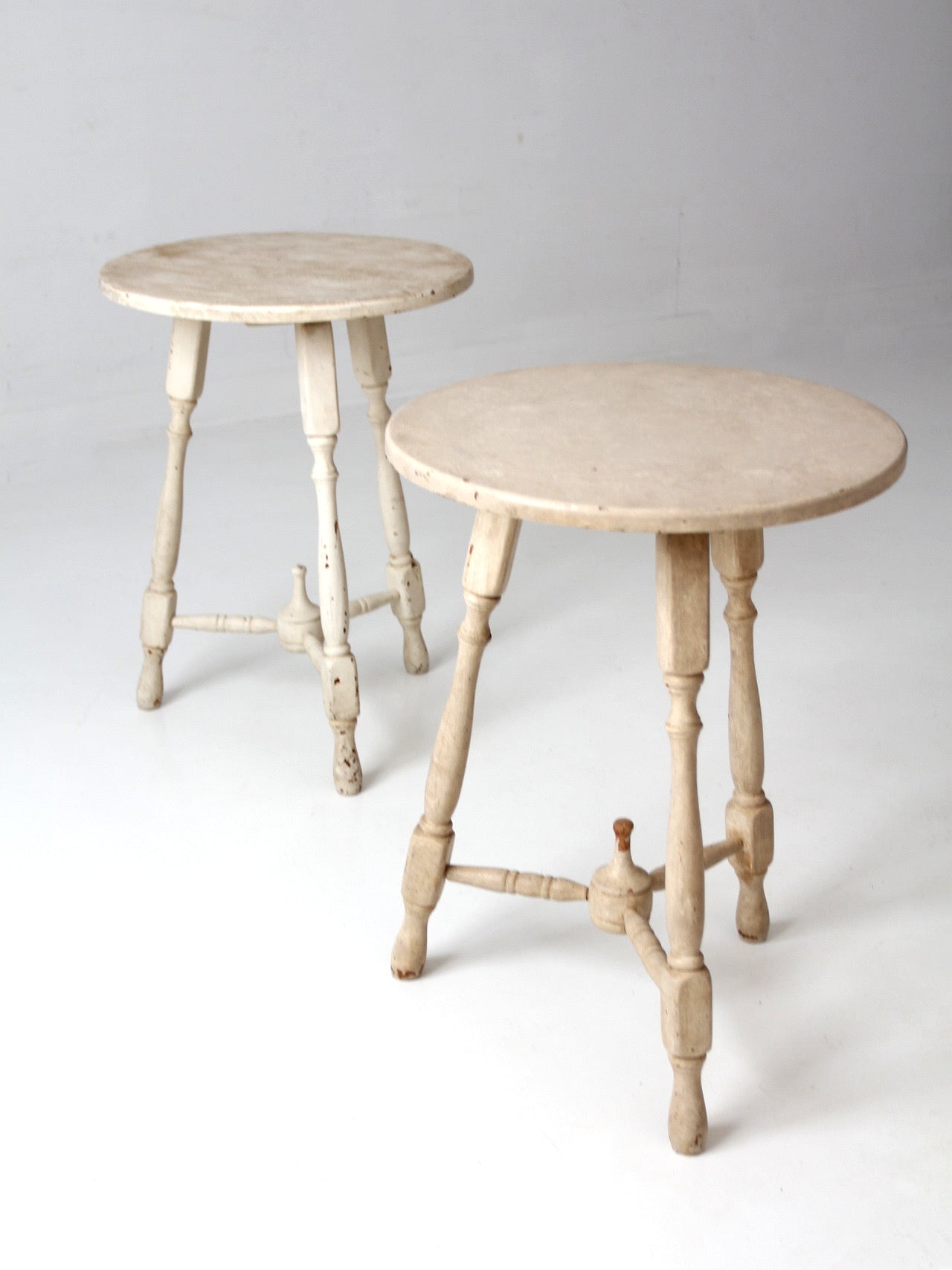 pair of vintage cottage pedestal tables