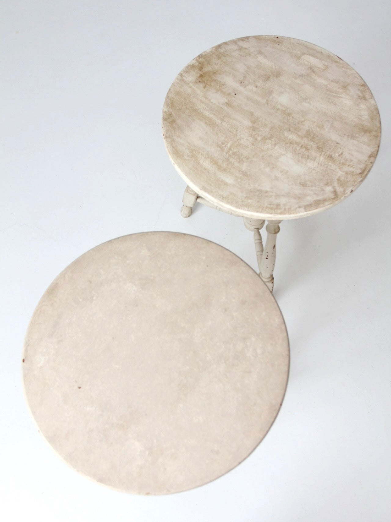 pair of vintage cottage pedestal tables