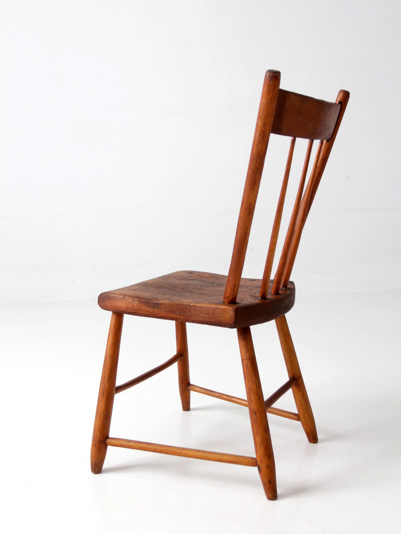 antique early American plank seat spindle back chair