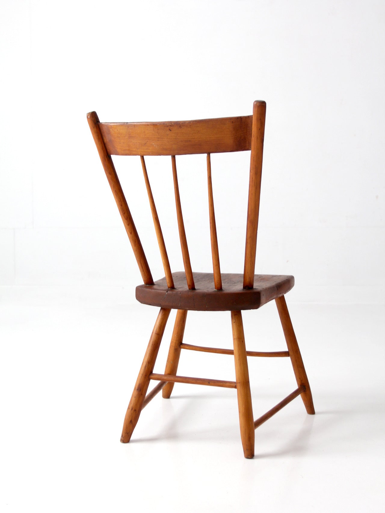 antique early American plank seat spindle back chair