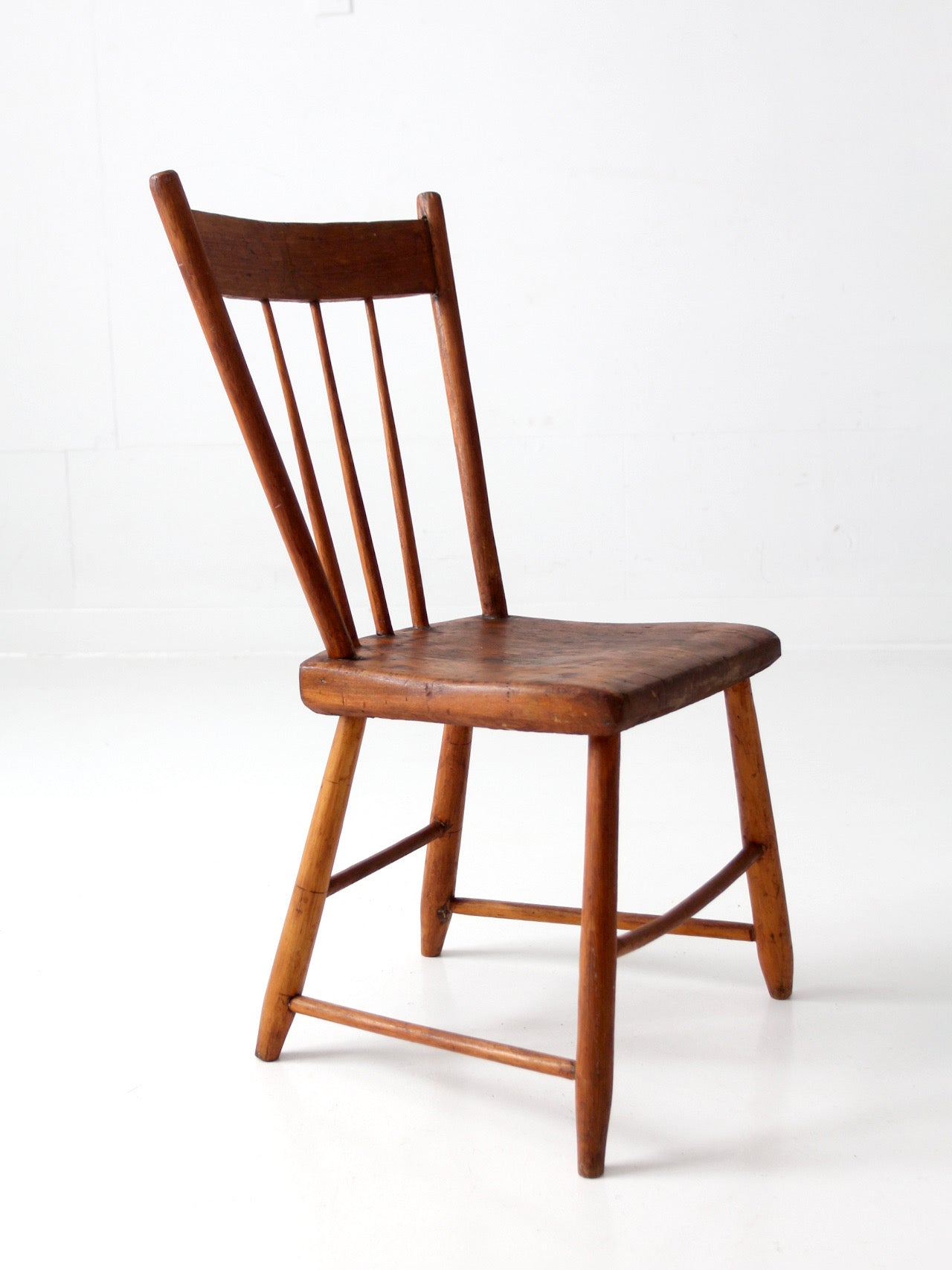 antique early American plank seat spindle back chair