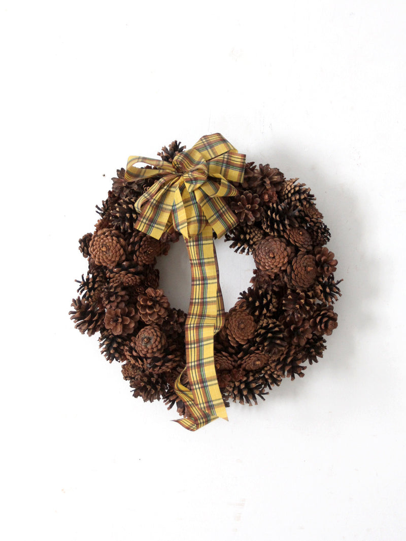 vintage pine cone wreath with tartan ribbon