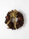vintage pine cone wreath with tartan ribbon