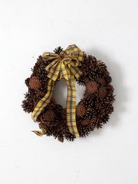 vintage pine cone wreath with tartan ribbon