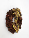 vintage pine cone wreath with tartan ribbon