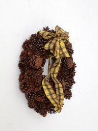 vintage pine cone wreath with tartan ribbon