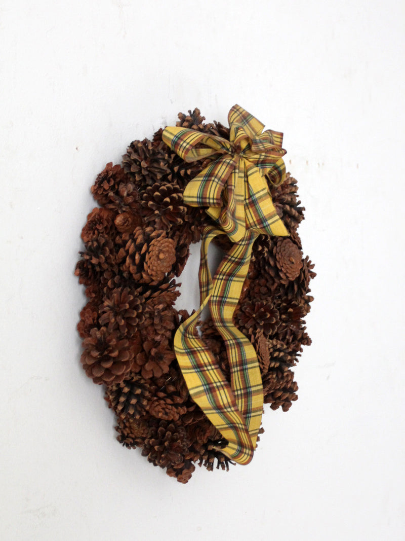vintage pine cone wreath with tartan ribbon