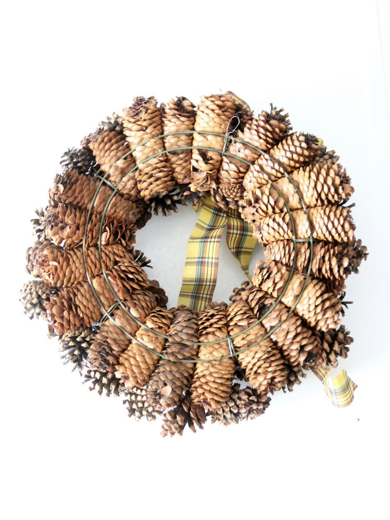 vintage pine cone wreath with tartan ribbon