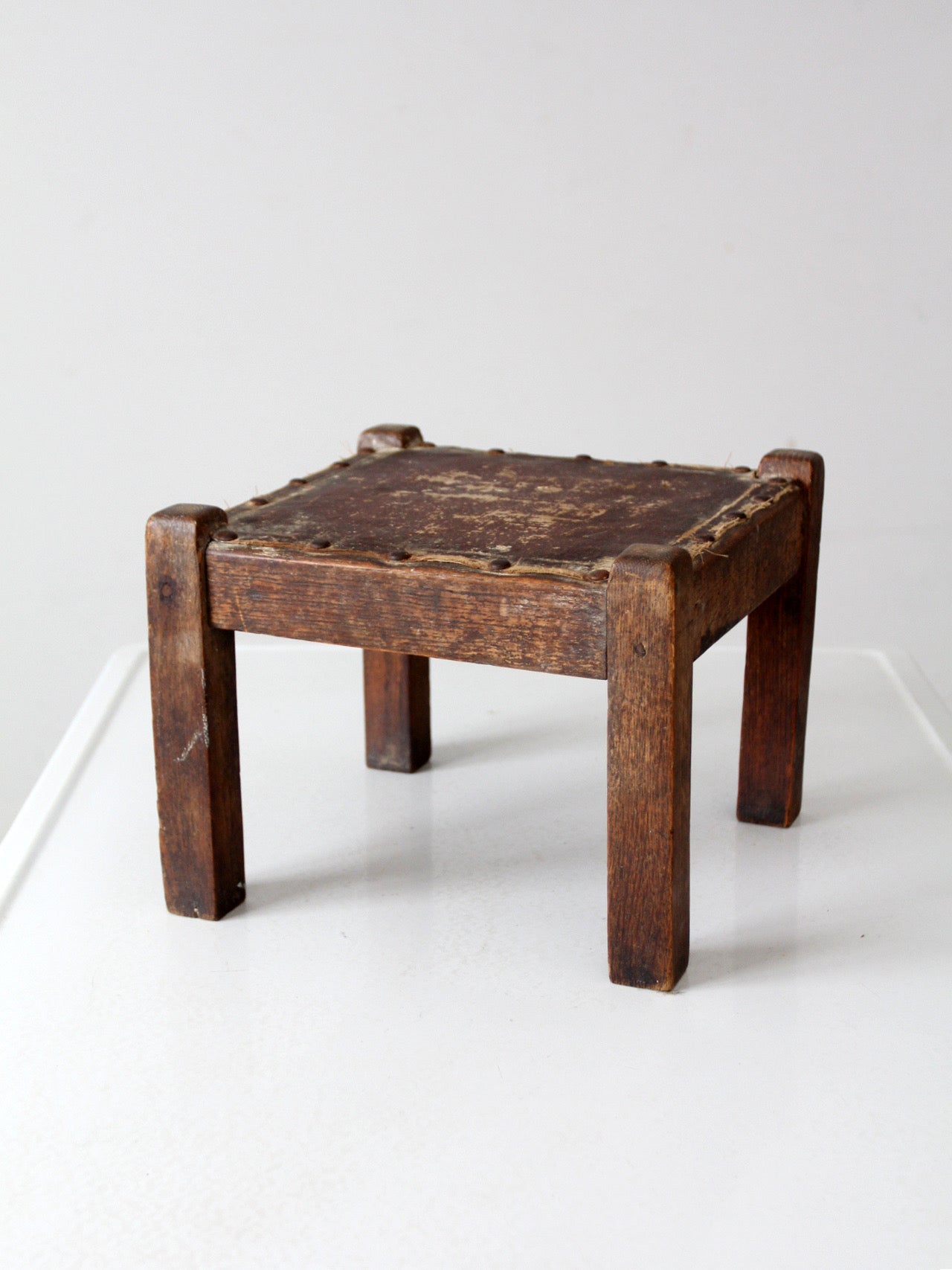 turn of the century upholstered wood footstool