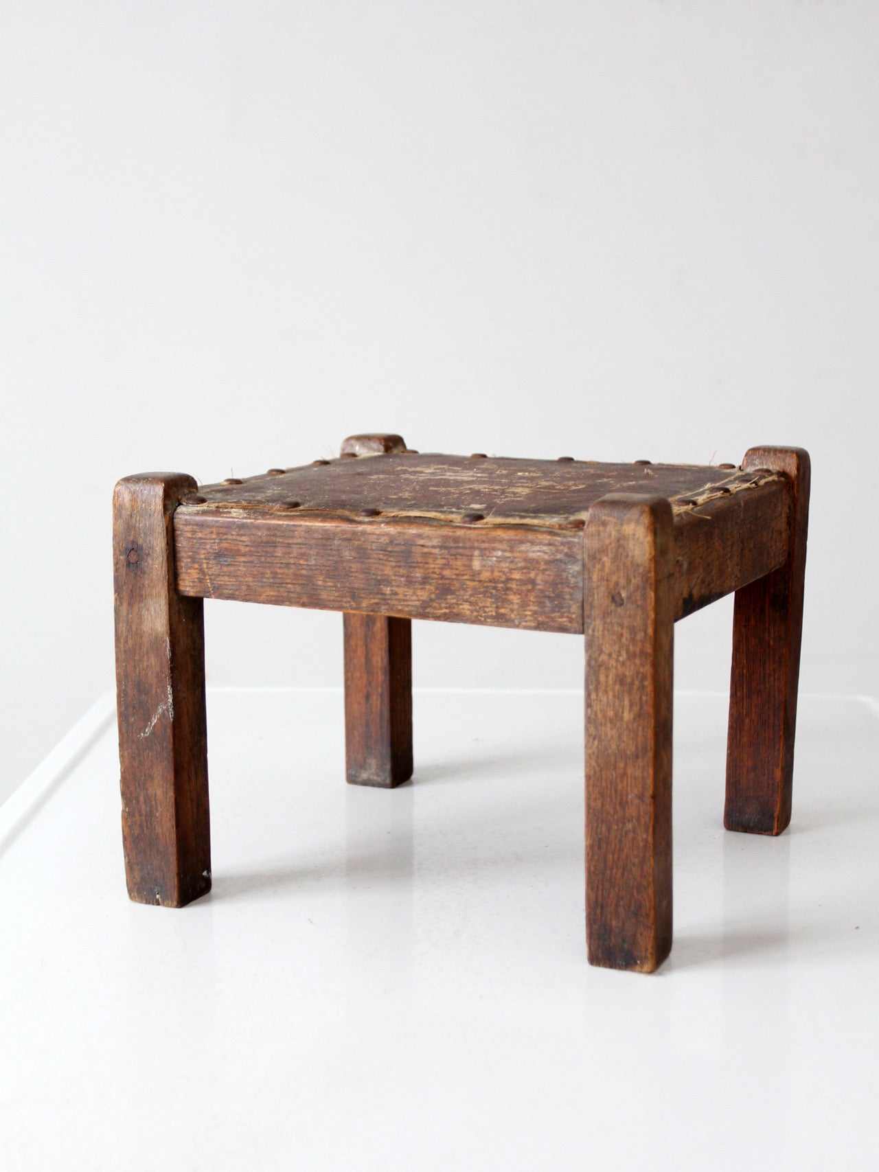 turn of the century upholstered wood footstool