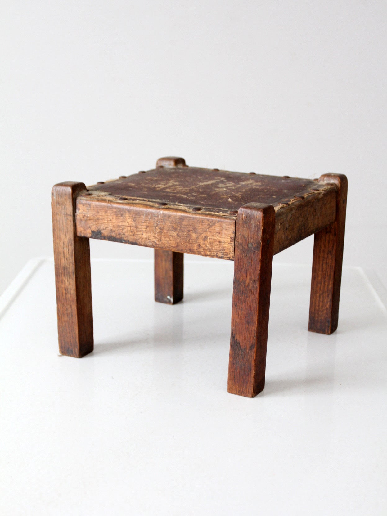 turn of the century upholstered wood footstool