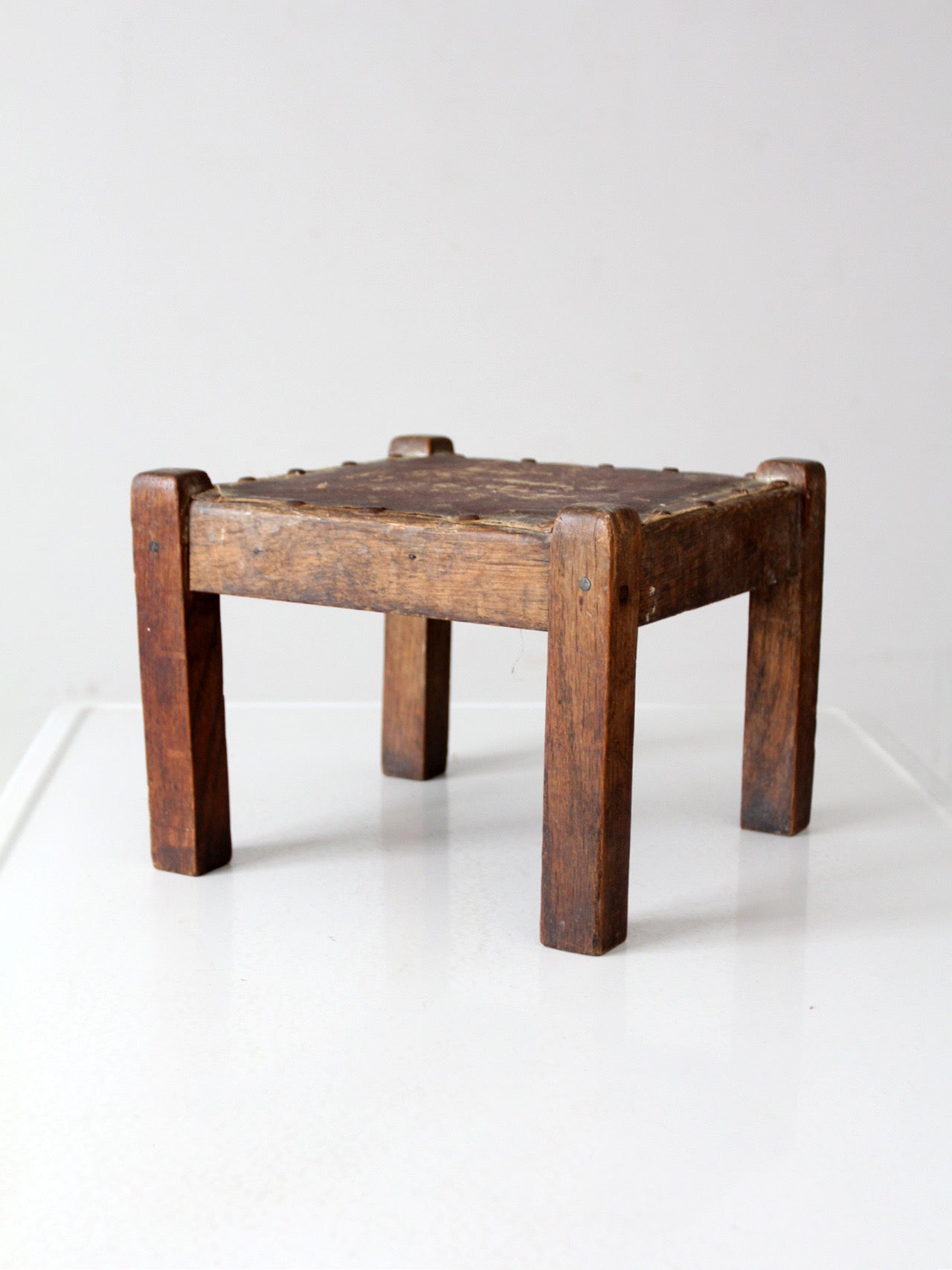 turn of the century upholstered wood footstool