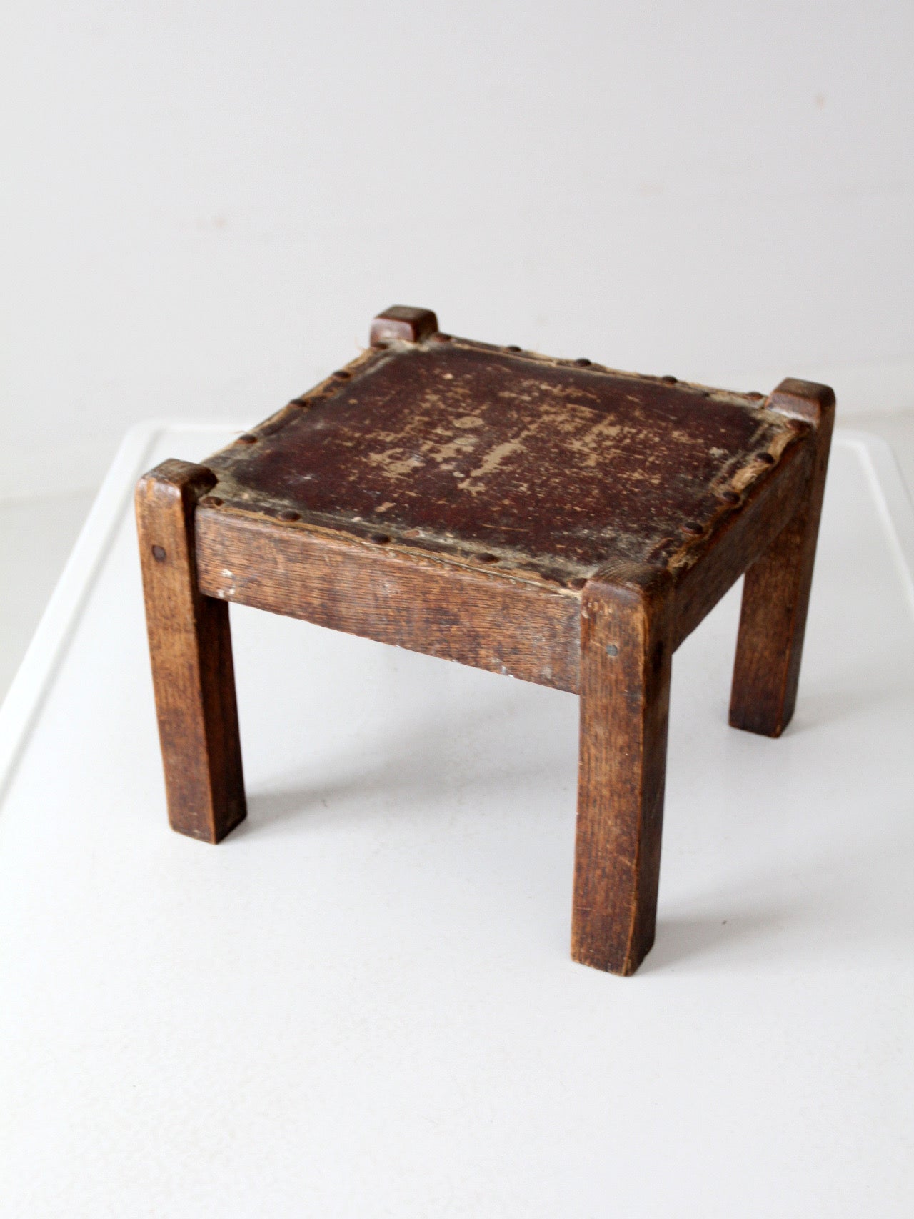 turn of the century upholstered wood footstool