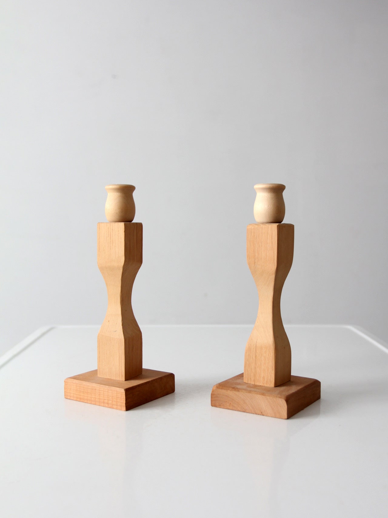 pair of vintage handmade wooden candlesticks