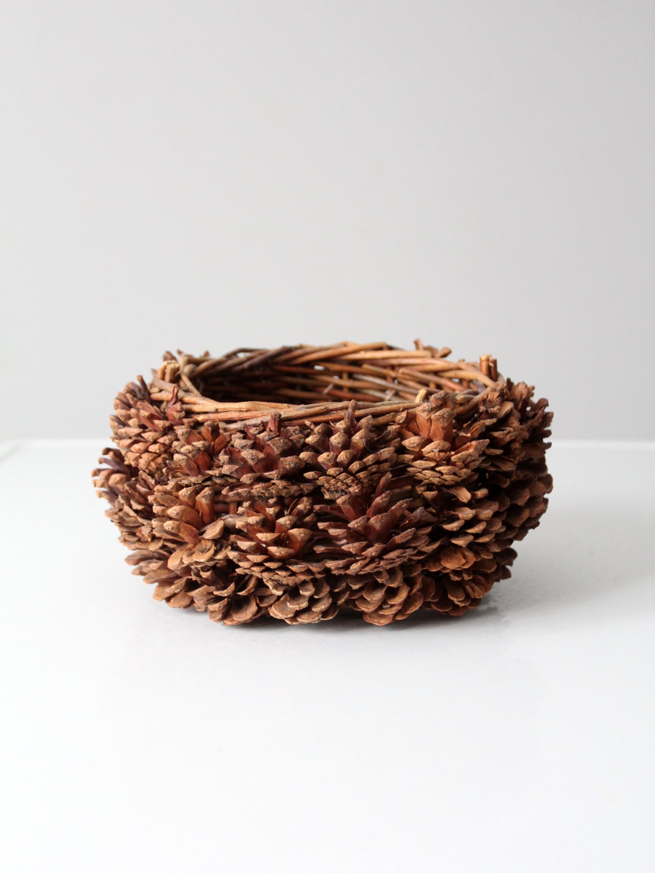 vintage handmade pinecone basket