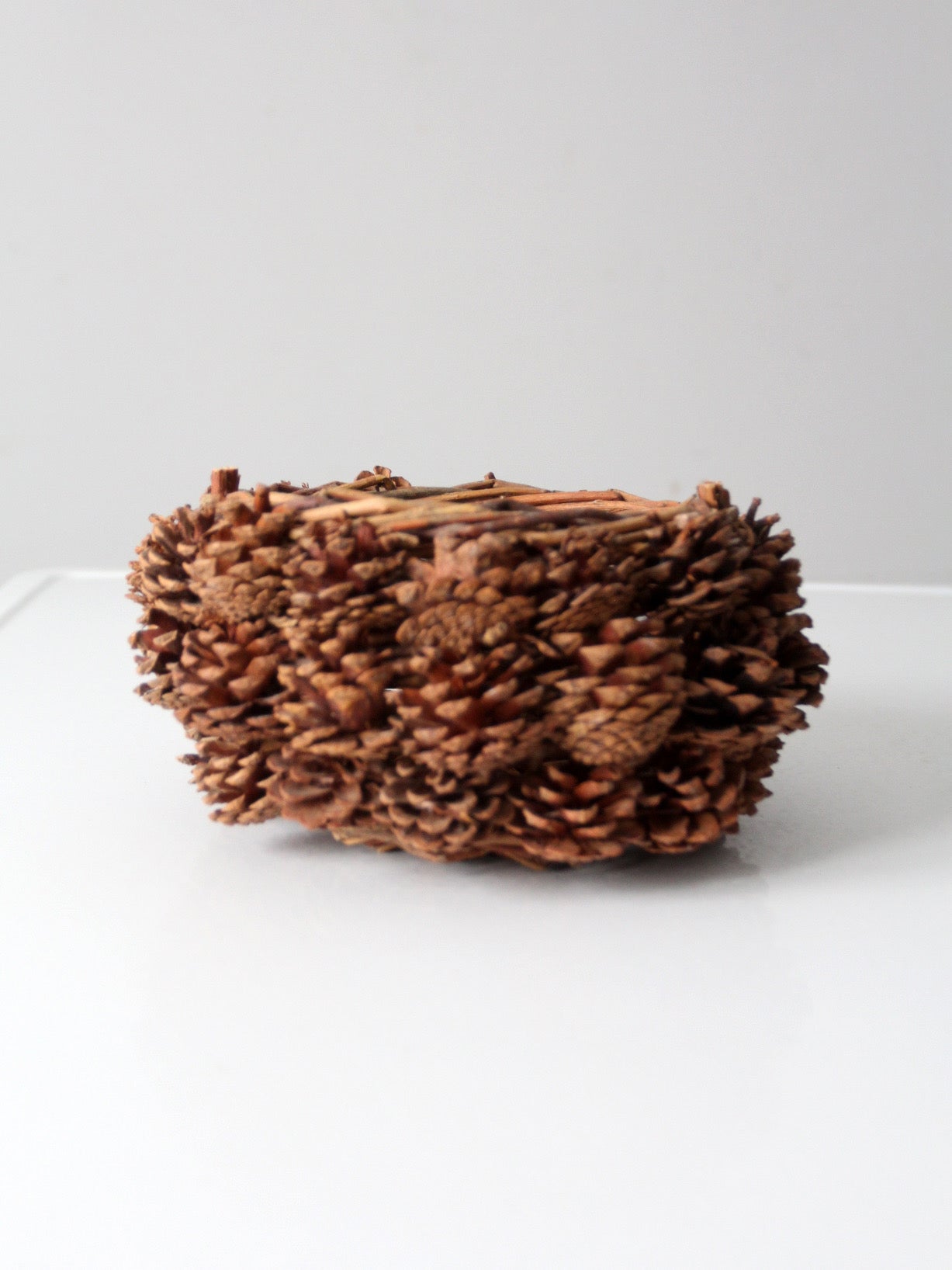 vintage handmade pinecone basket