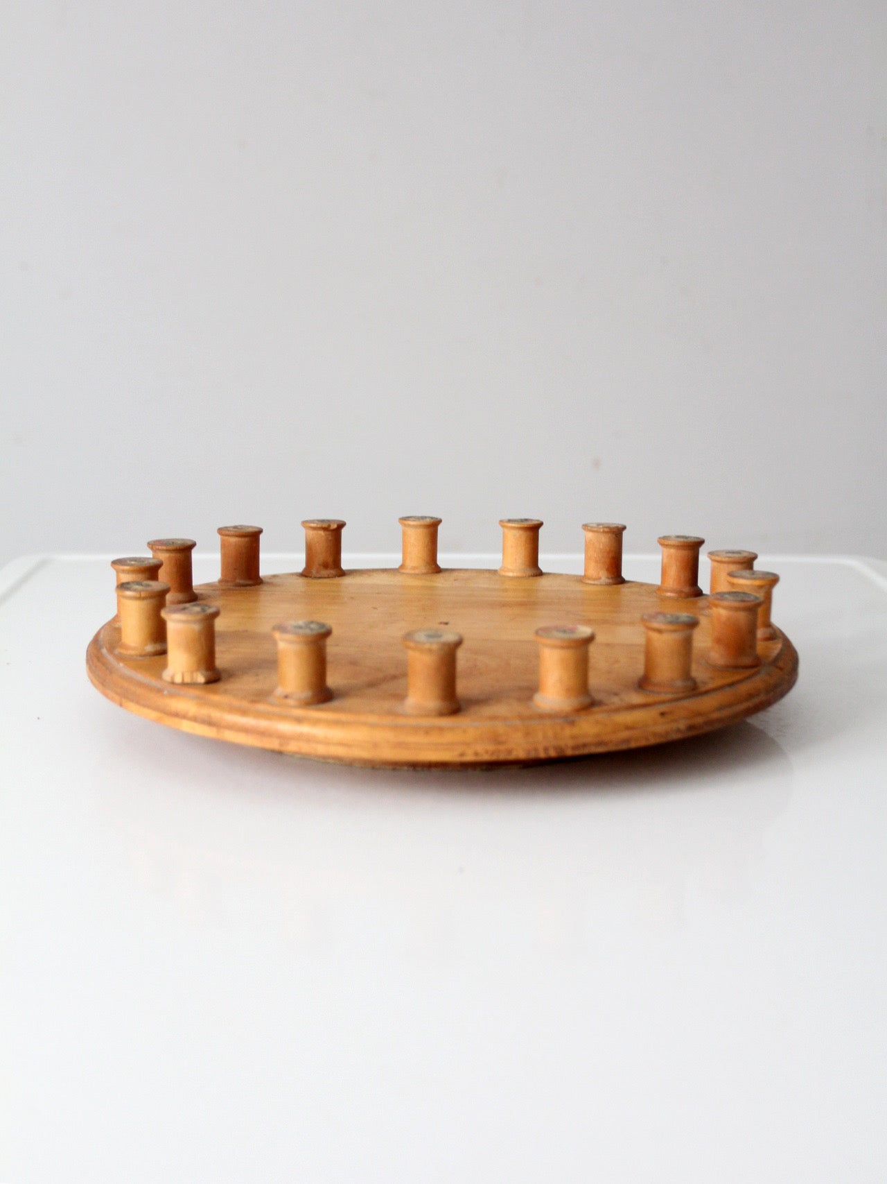 vintage folk art lazy Susan with thread spools
