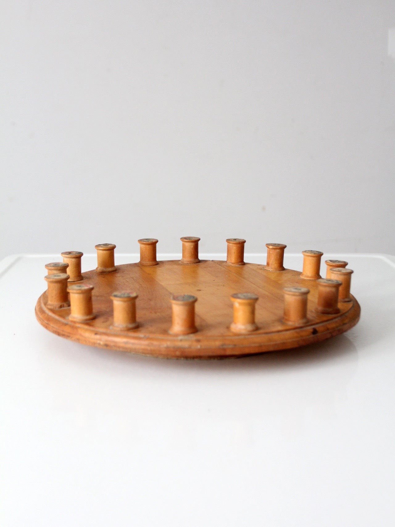 vintage folk art lazy Susan with thread spools