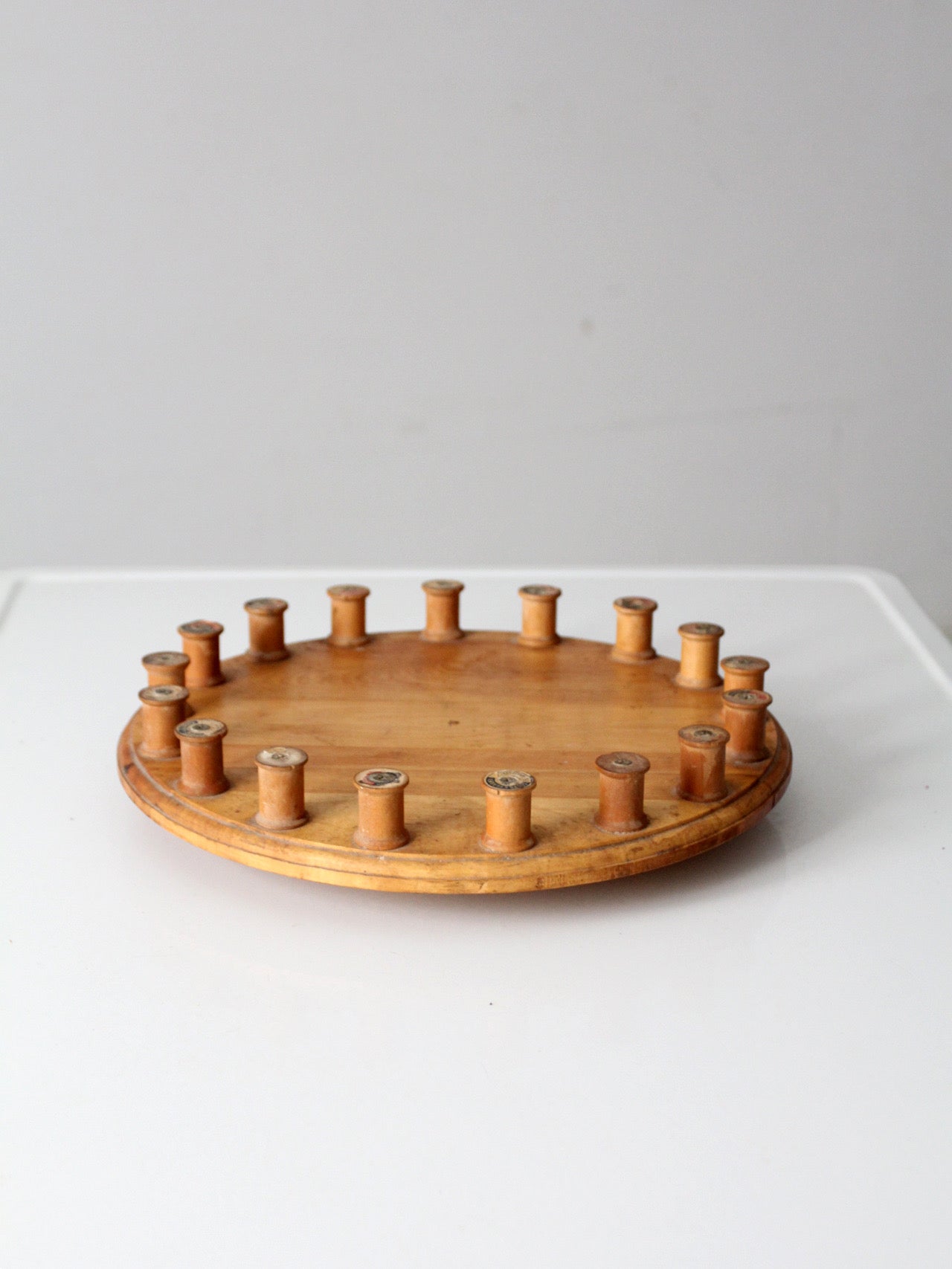 vintage folk art lazy Susan with thread spools