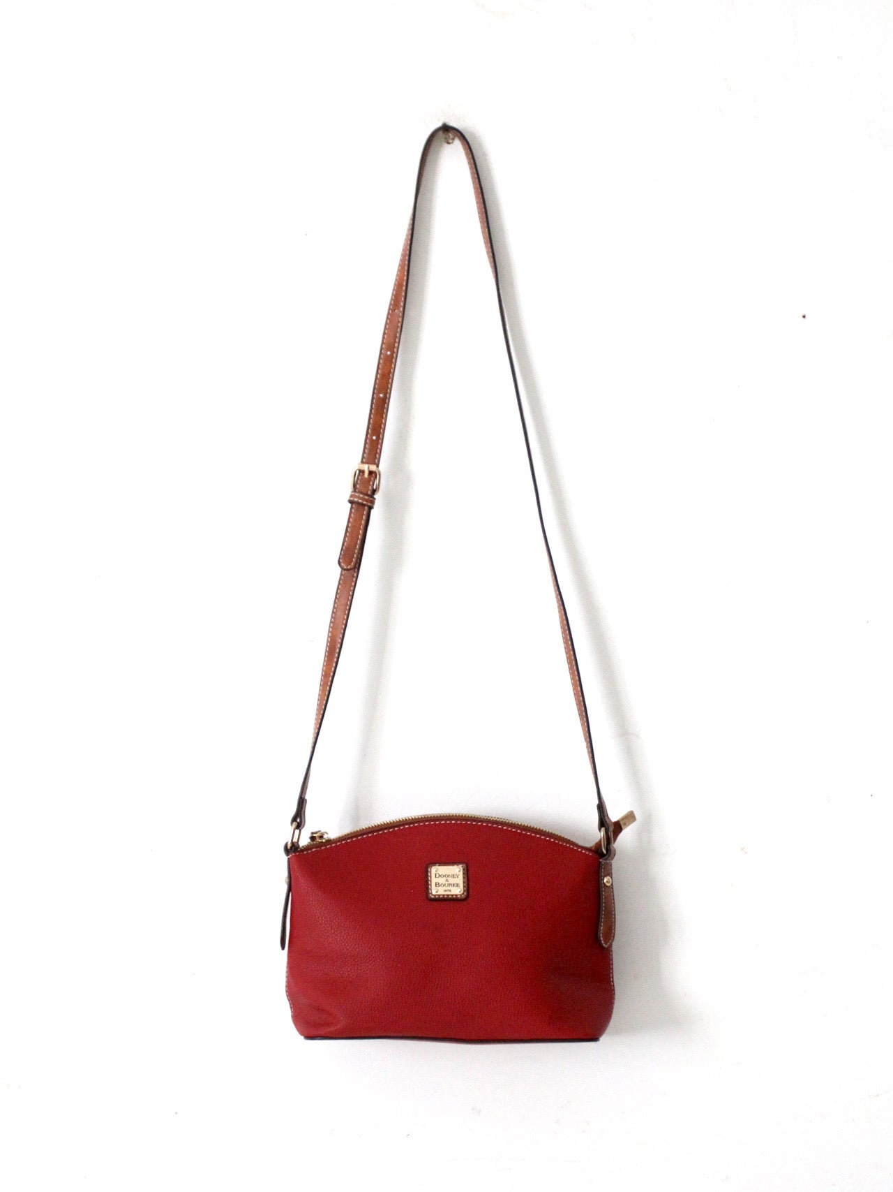 Dooney & Bourke red pebble leather domed crossbody bag