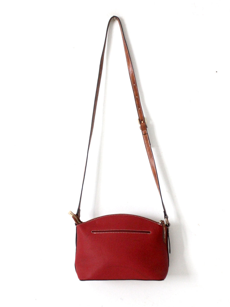 Dooney & Bourke red pebble leather domed crossbody bag