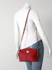 Dooney & Bourke red pebble leather domed crossbody bag