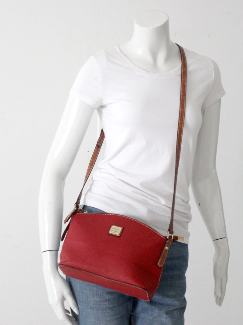 Dooney & Bourke red pebble leather domed crossbody bag