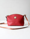 Dooney & Bourke red pebble leather domed crossbody bag