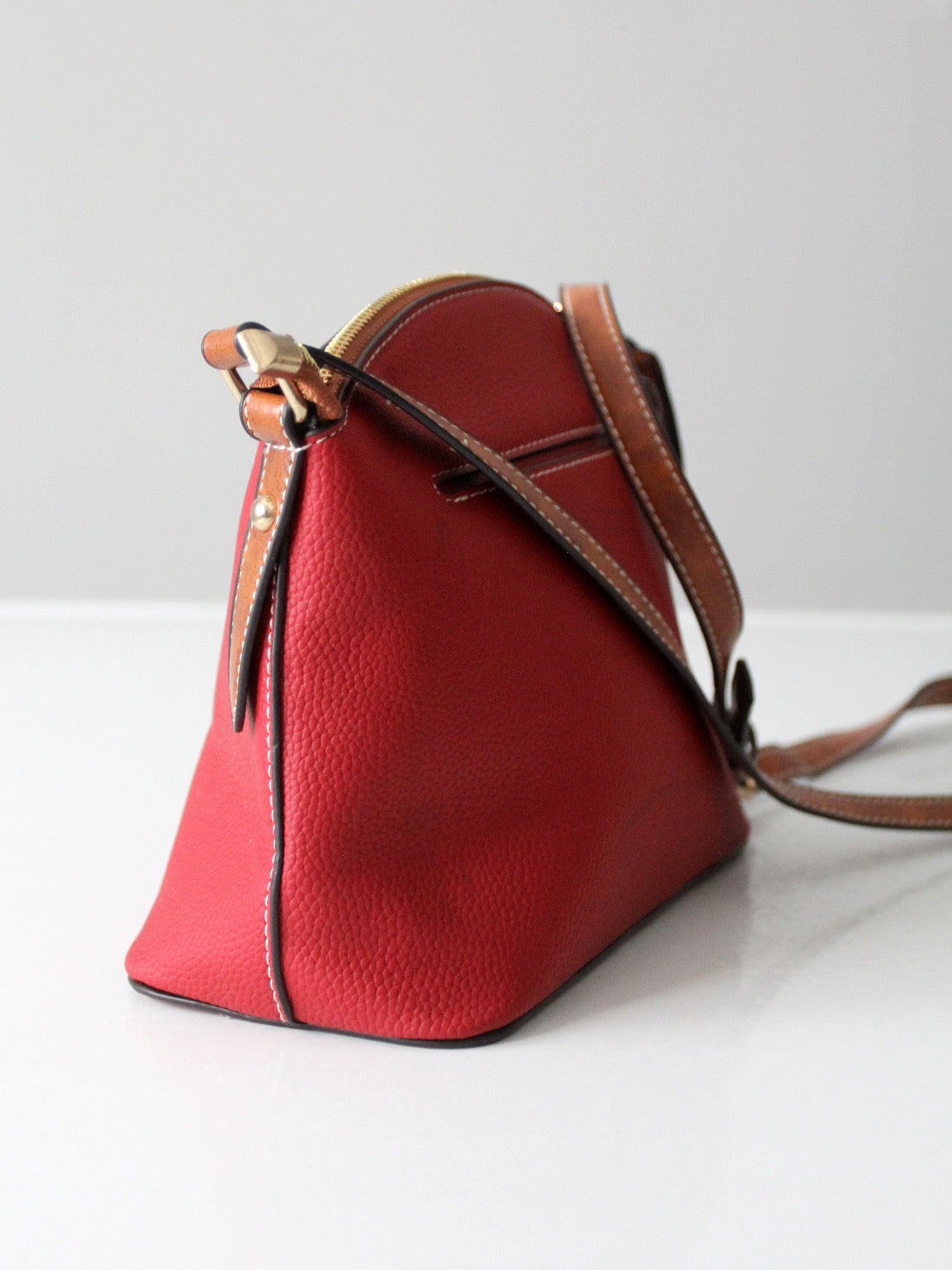 Dooney & Bourke red pebble leather domed crossbody bag