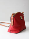 Dooney & Bourke red pebble leather domed crossbody bag