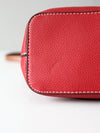 Dooney & Bourke red pebble leather domed crossbody bag