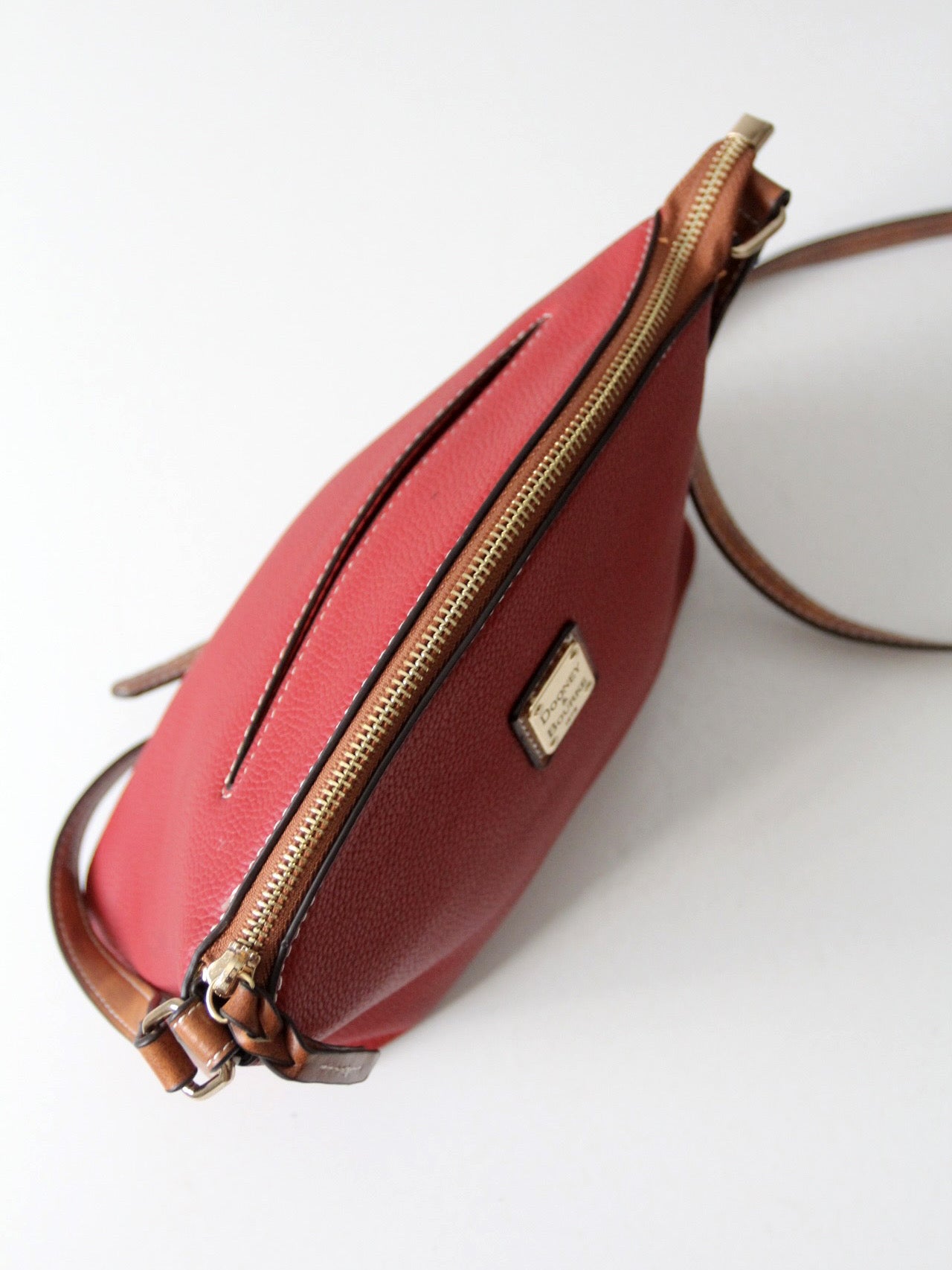 Dooney & Bourke red pebble leather domed crossbody bag