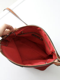 Dooney & Bourke red pebble leather domed crossbody bag