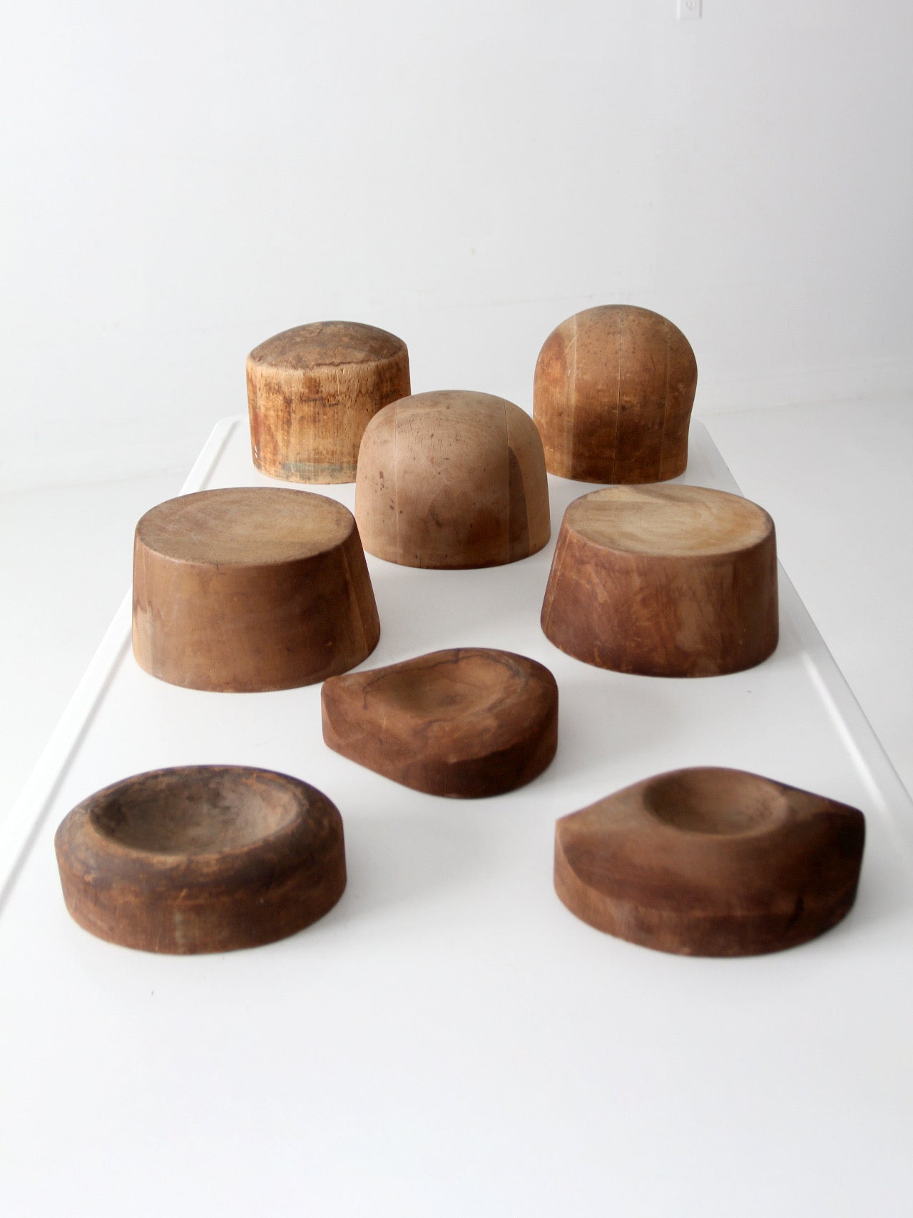 collection of antique wooden millinery hat blocks & forms