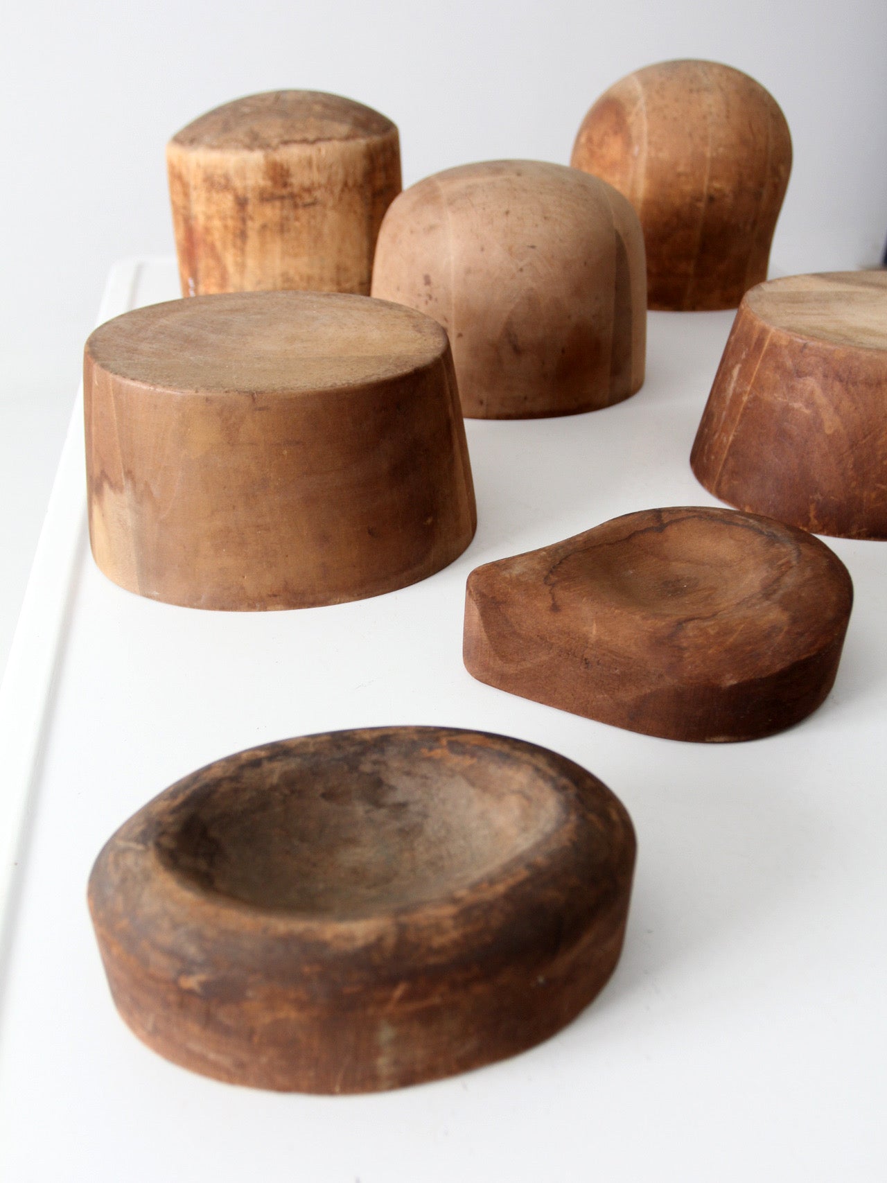 collection of antique wooden millinery hat blocks & forms