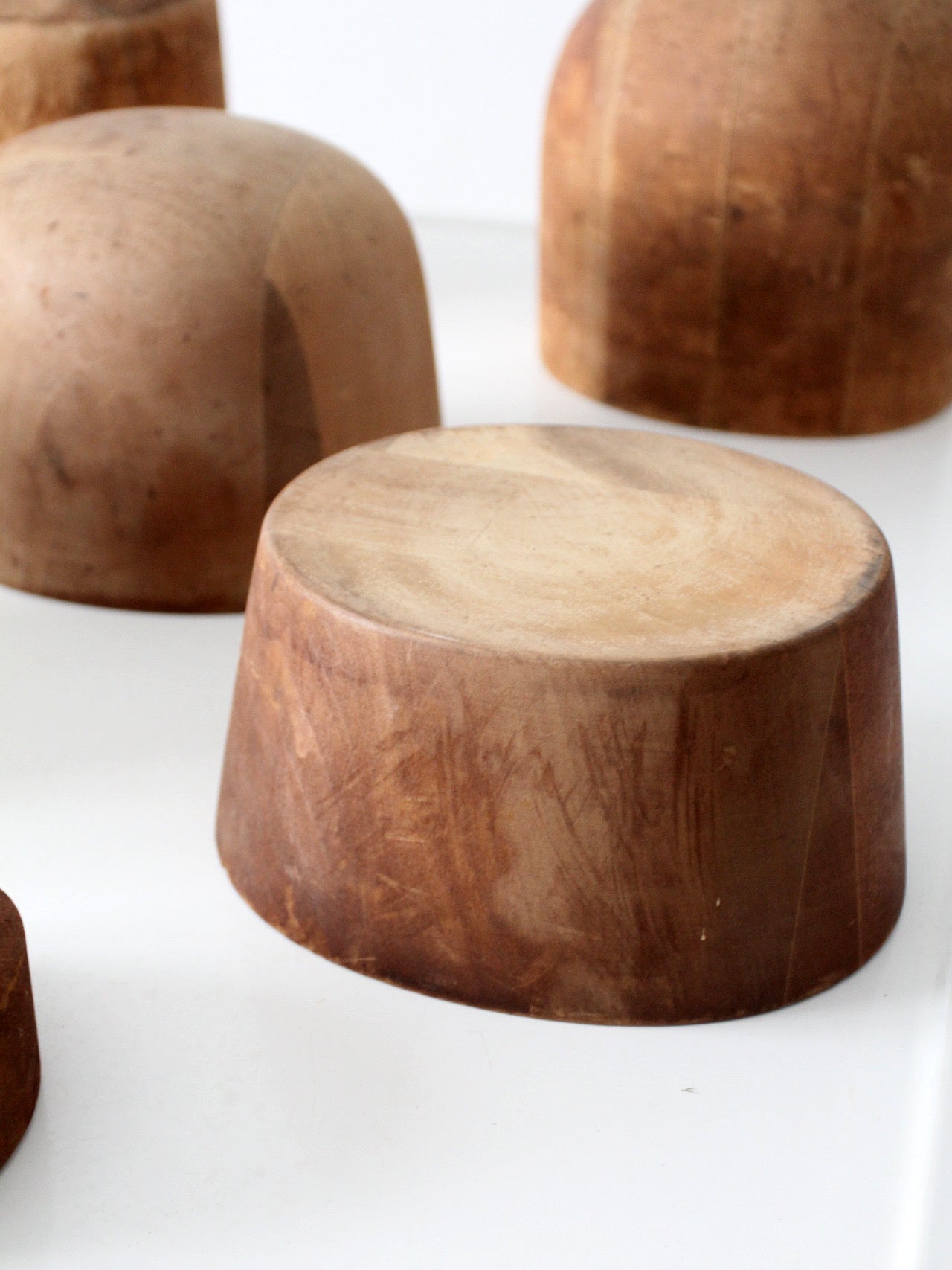 collection of antique wooden millinery hat blocks & forms