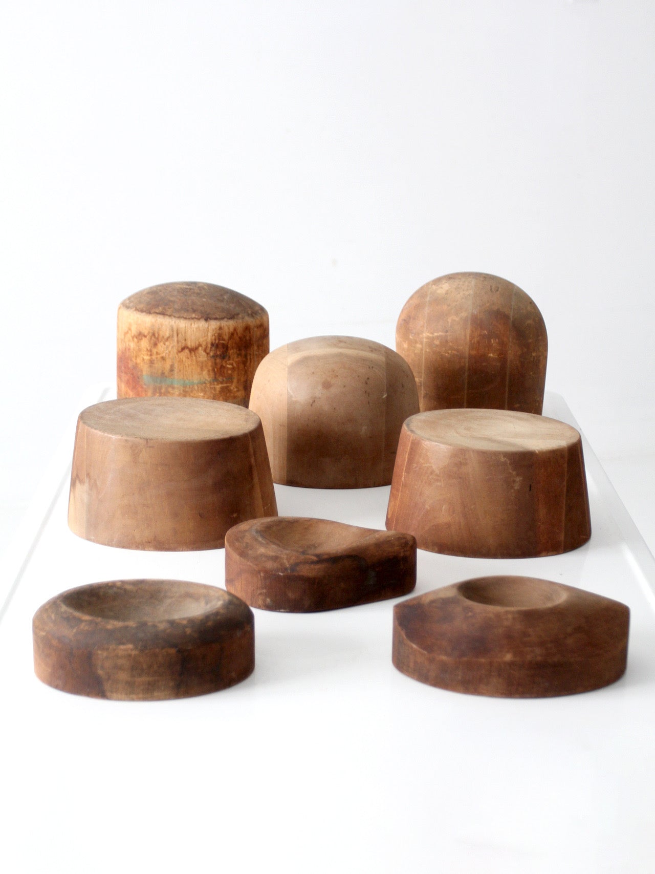 collection of antique wooden millinery hat blocks & forms