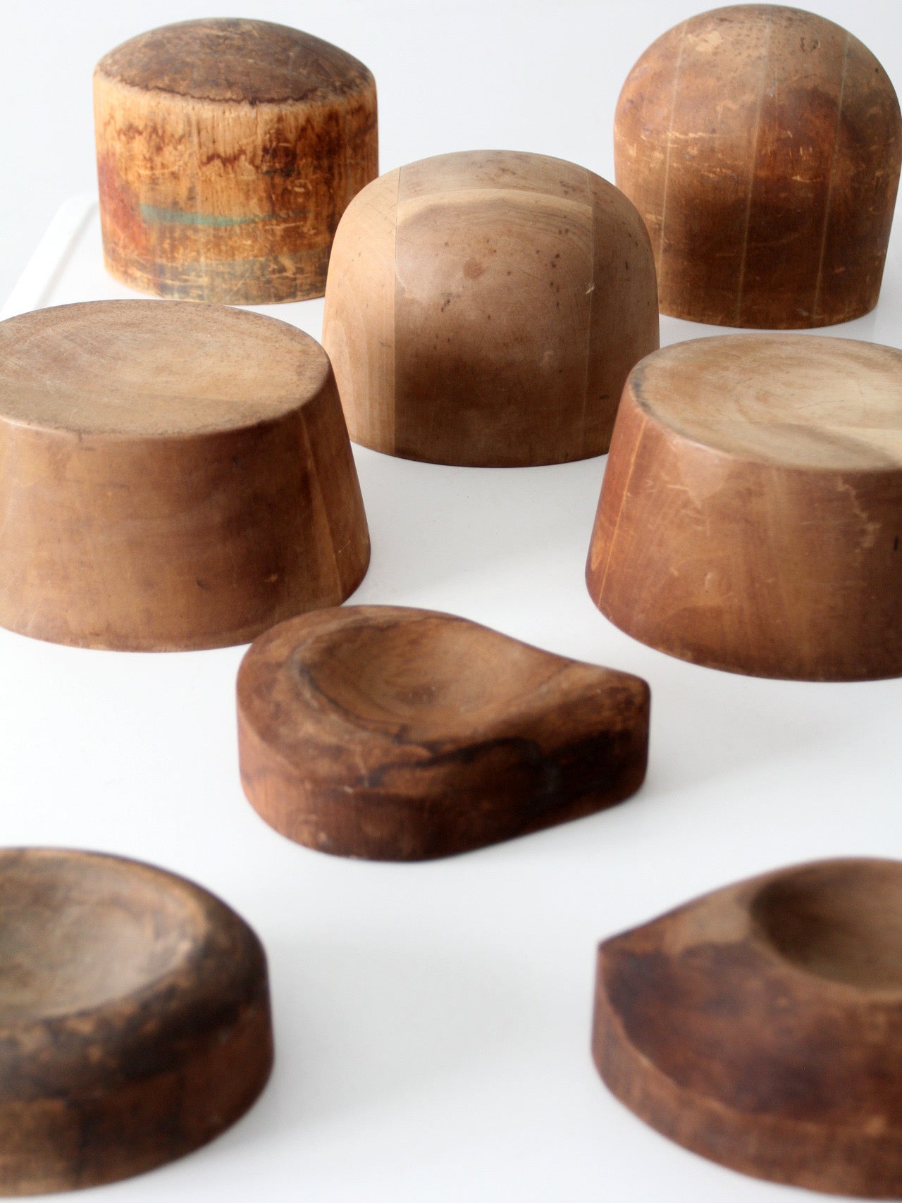 collection of antique wooden millinery hat blocks & forms