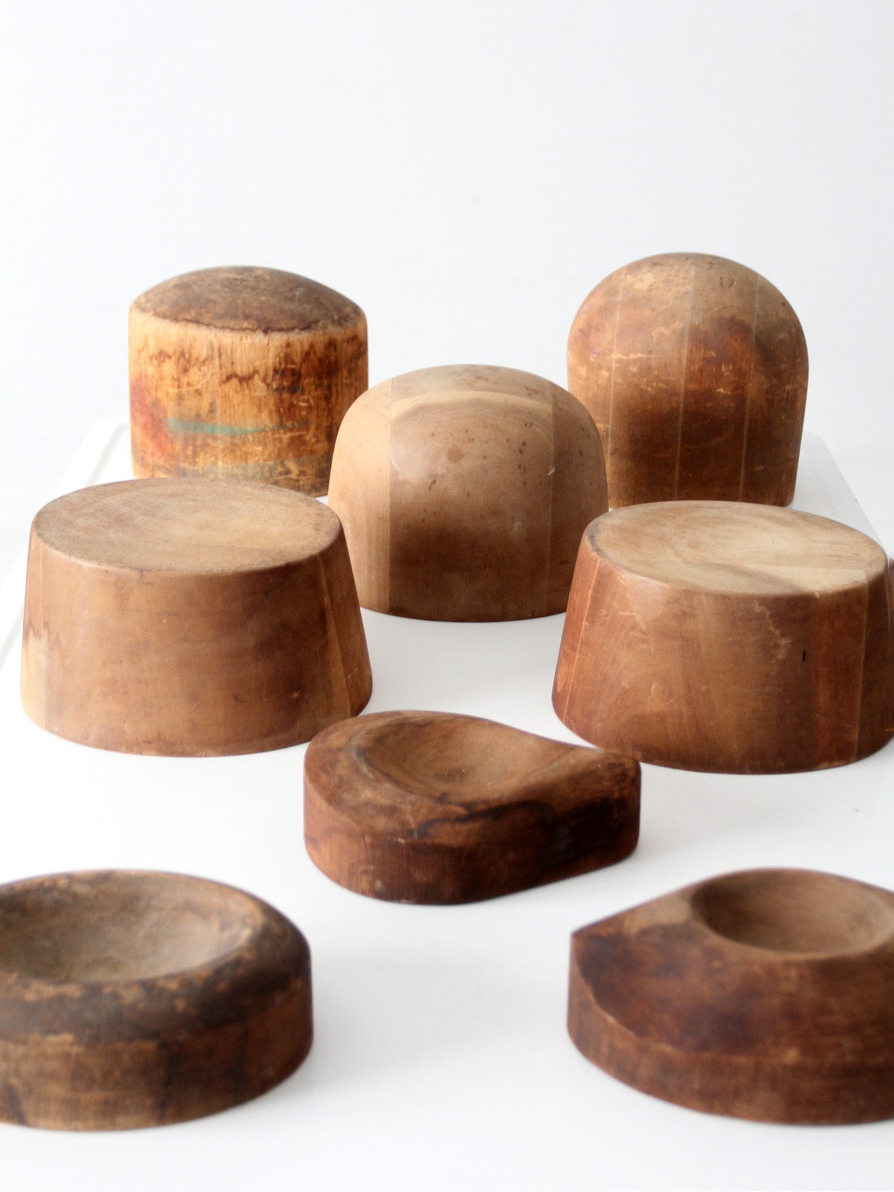 collection of antique wooden millinery hat blocks & forms