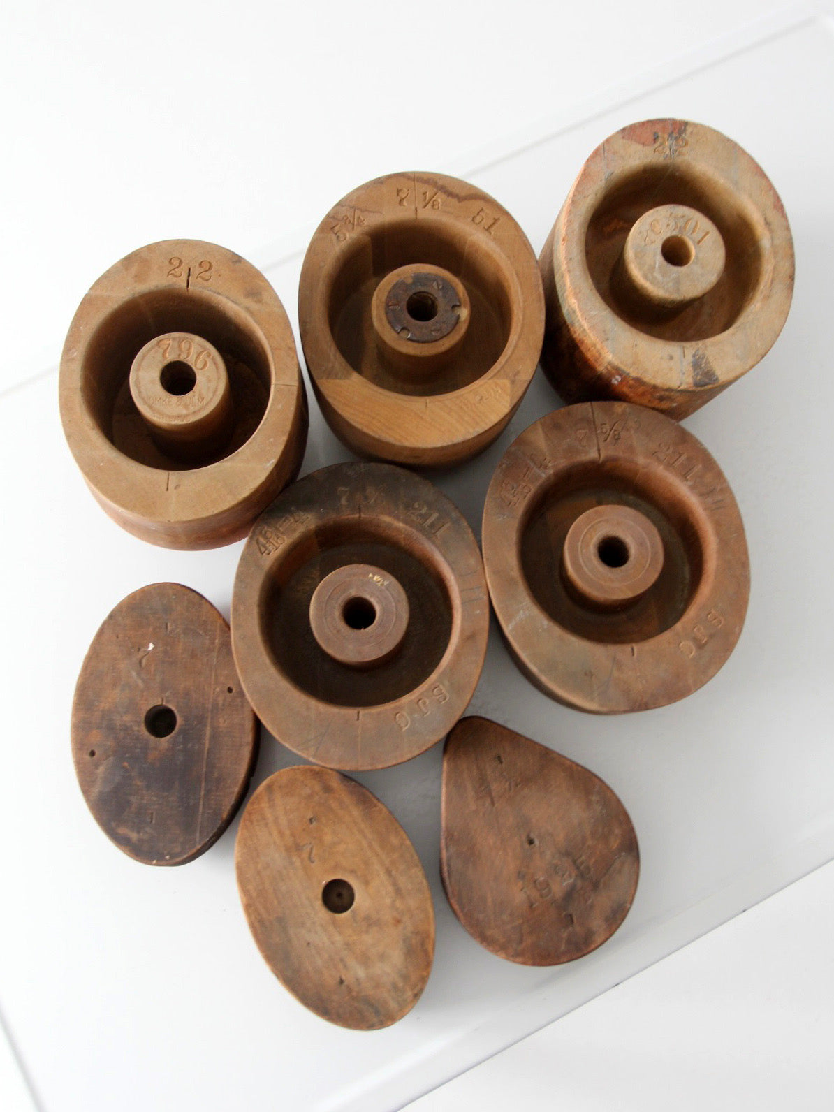 collection of antique wooden millinery hat blocks & forms