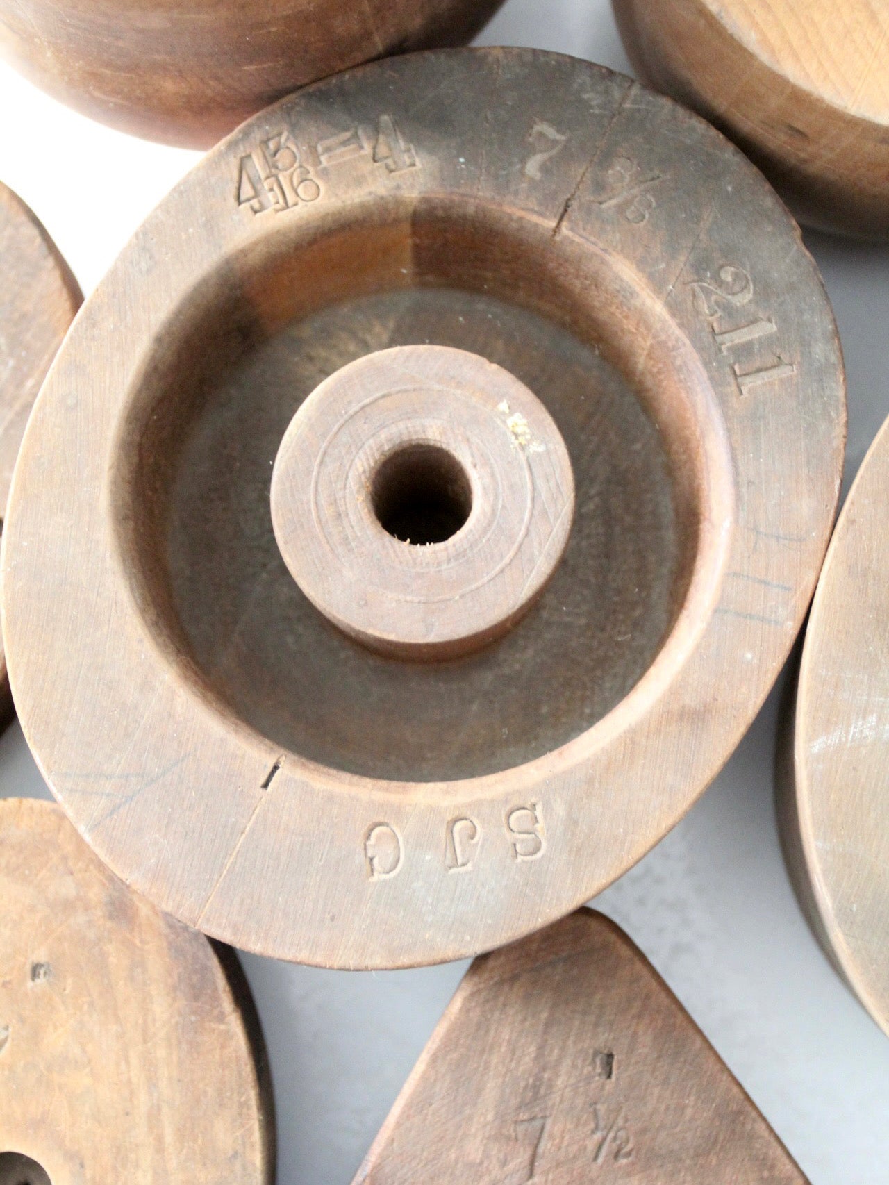 collection of antique wooden millinery hat blocks & forms
