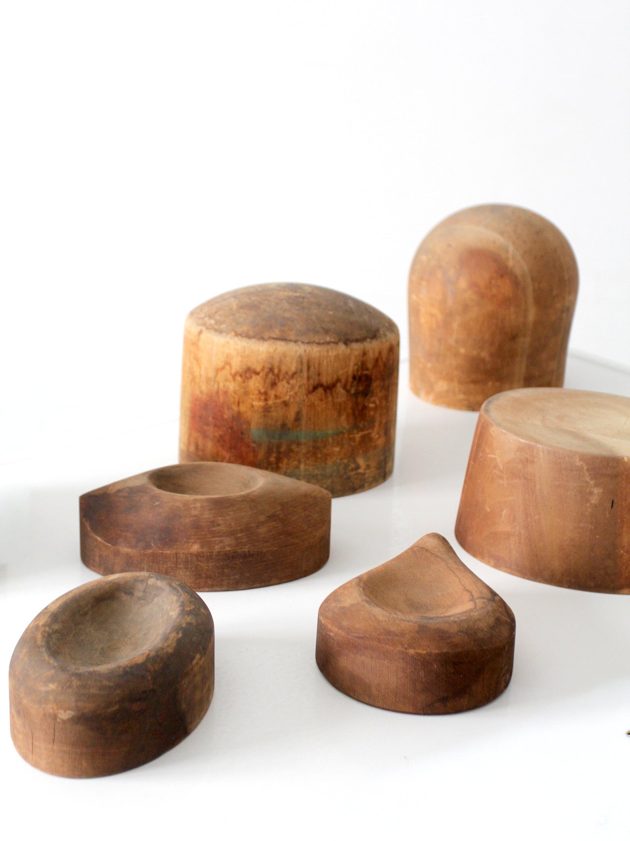 collection of antique wooden millinery hat blocks & forms