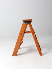 vintage orange wooden step ladder