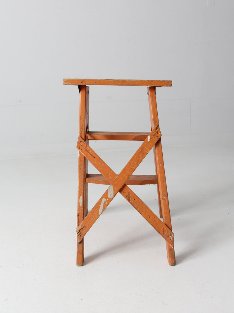 vintage orange wooden step ladder