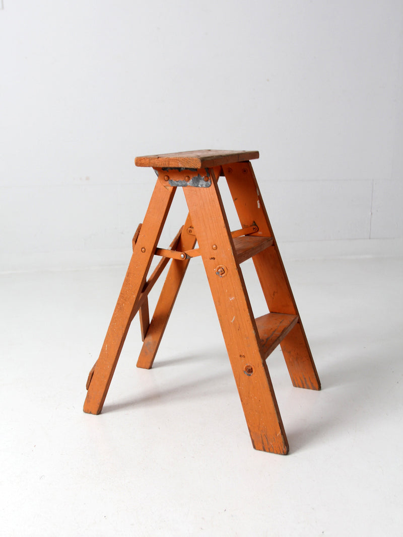 vintage orange wooden step ladder