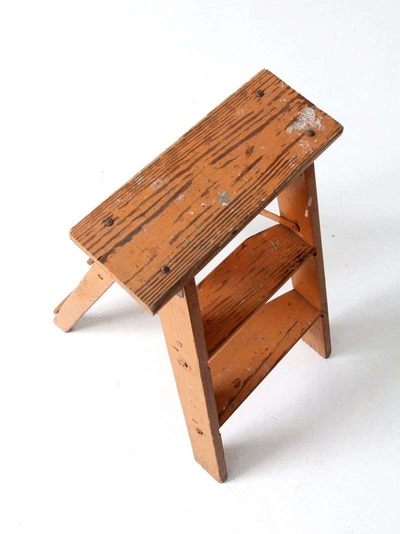 vintage orange wooden step ladder